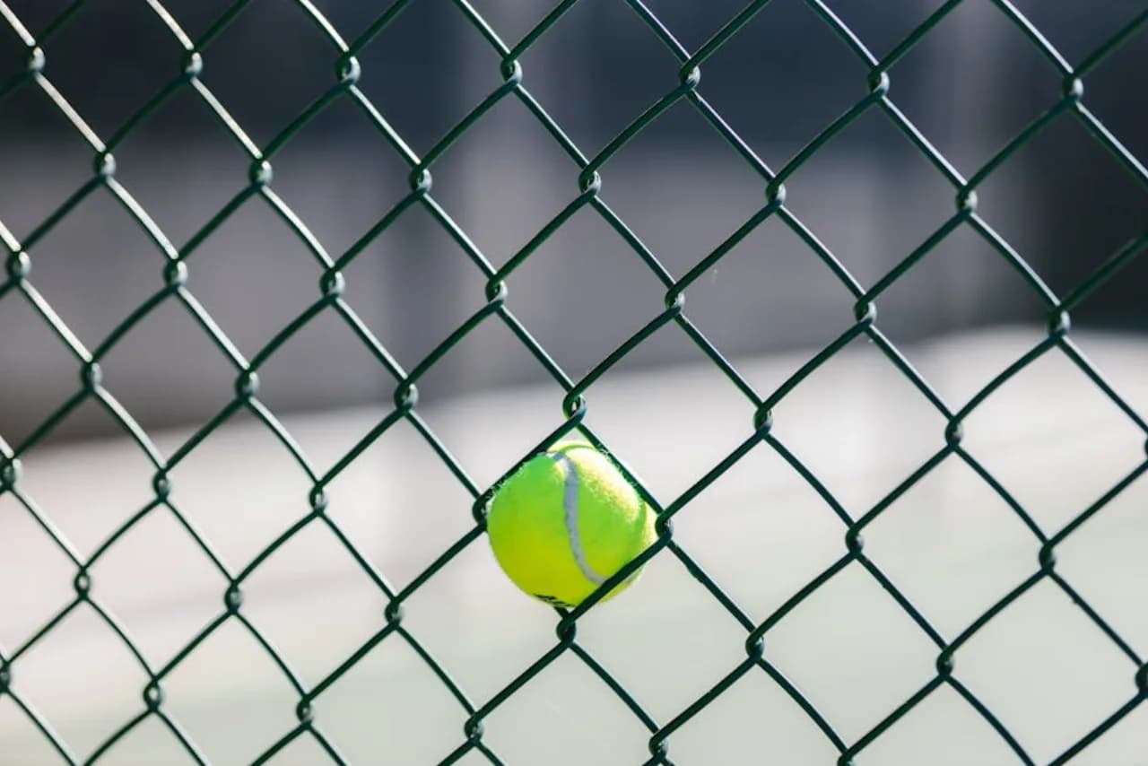 Municipal park perimeter fence — forest-green chain-link and ornamental aluminum — Fenced.ca