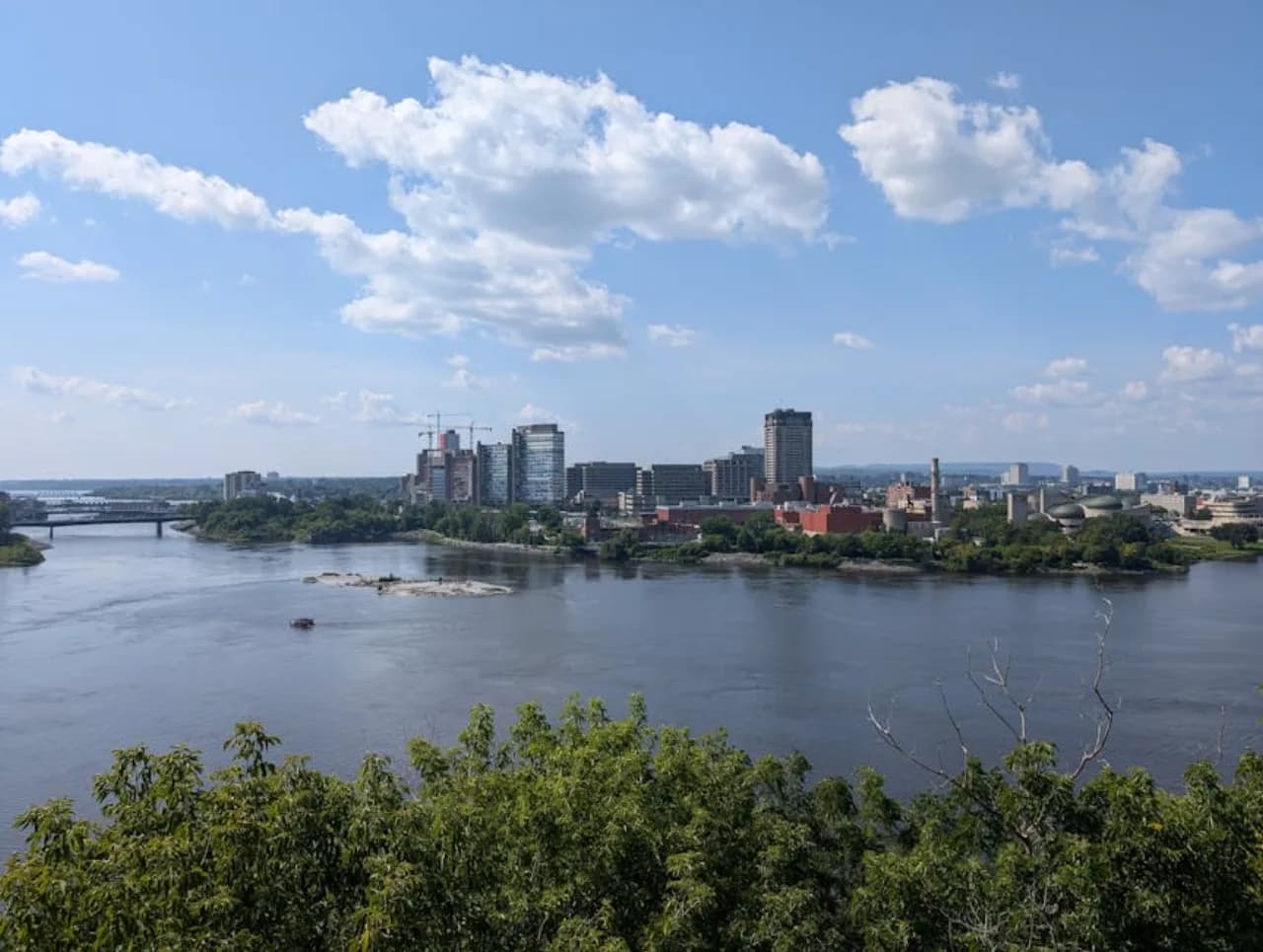 Skyline of Longueuil, Quebec, Canada — fence supply, rental and installation by Fenced.ca